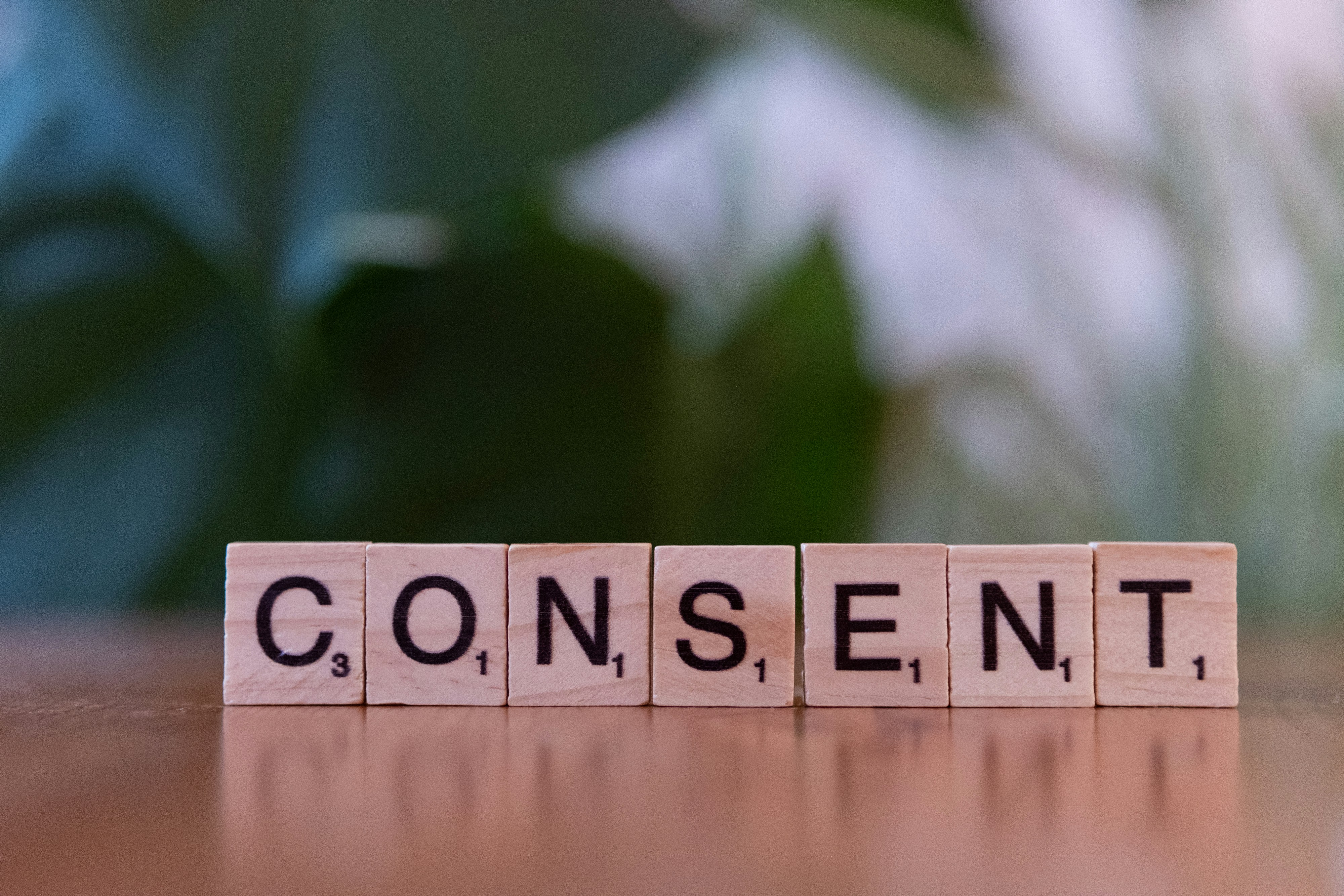 Consent written on wooden tiles